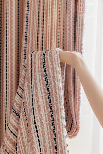 Striped curtains in Fair Isle jacquard design, featuring black and pink hues, perfect for playrooms.