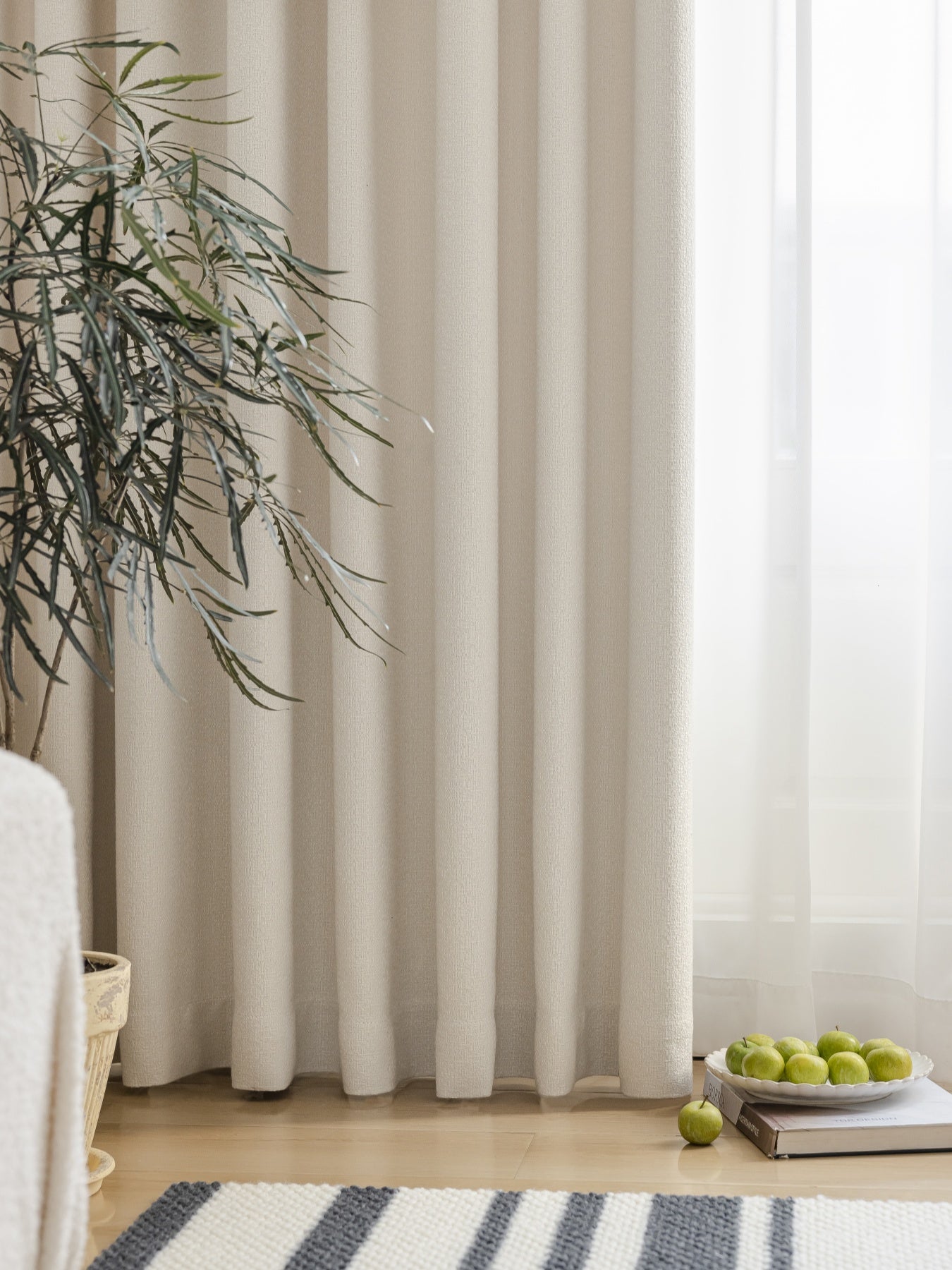 Heavyweight linen blend pleated curtains in cream color, enhancing a modern living room with natural, eco-friendly decor
