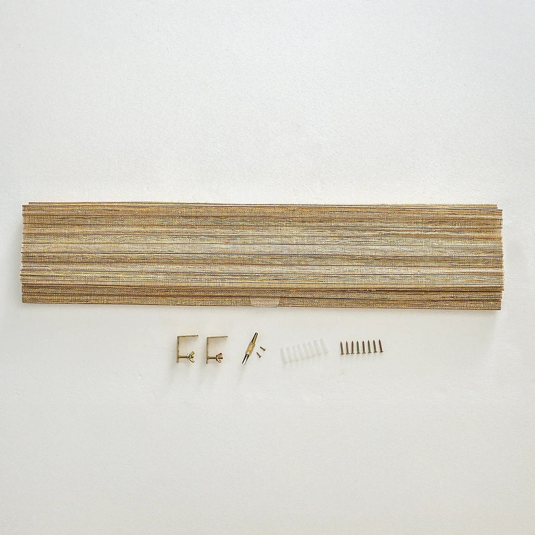 Natural hemp outdoor bamboo shades in beige brown with installation hardware.
