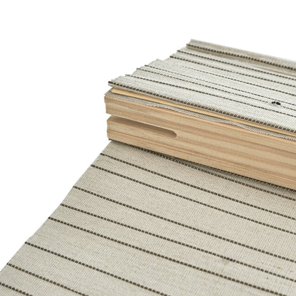 Natural linen bamboo shade with black stripes, showcasing eco-friendly material and handwoven design.