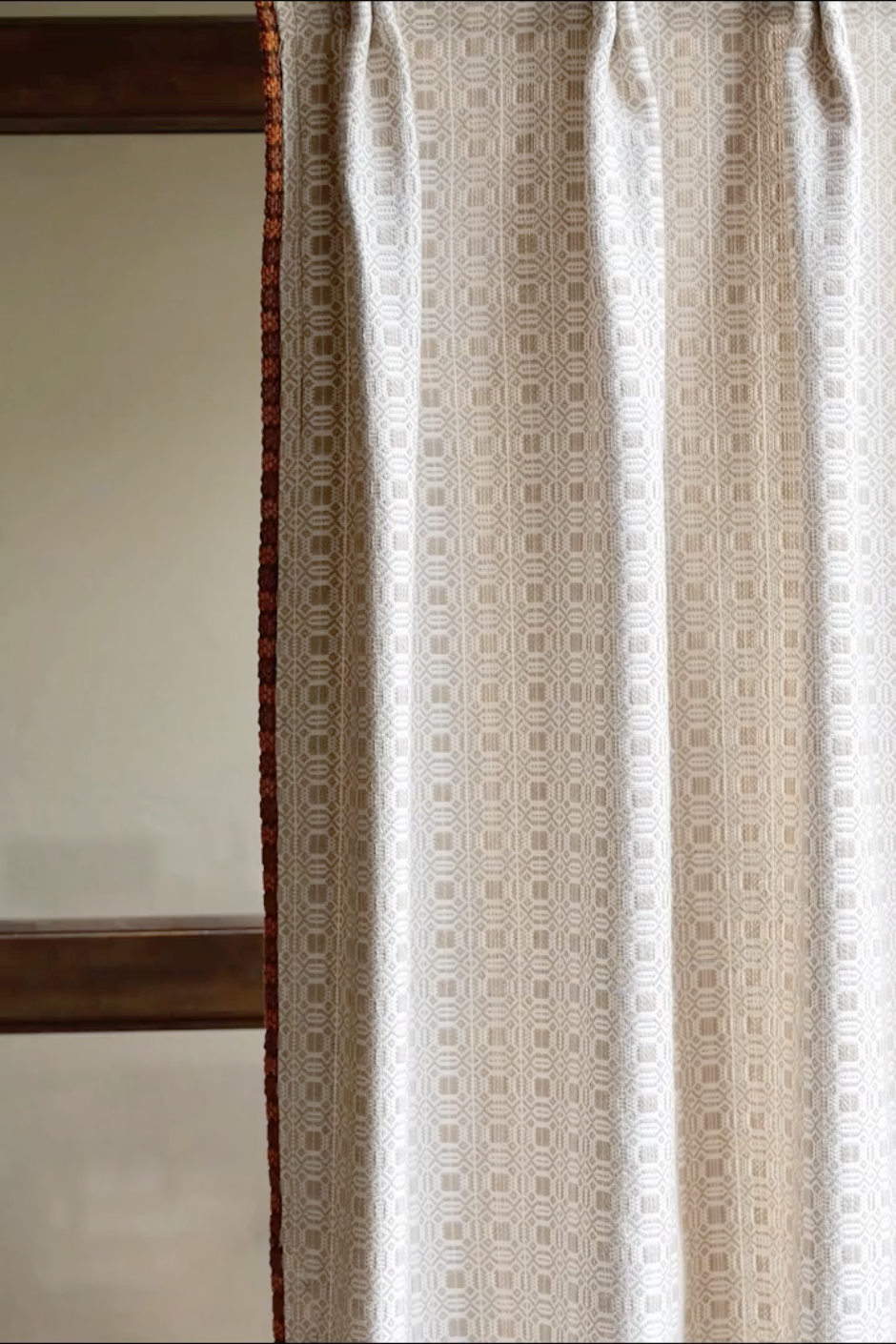 Vintage curtains with subtle geometric pattern and elegant neutral tones, inspired by classic Fifth Avenue style.