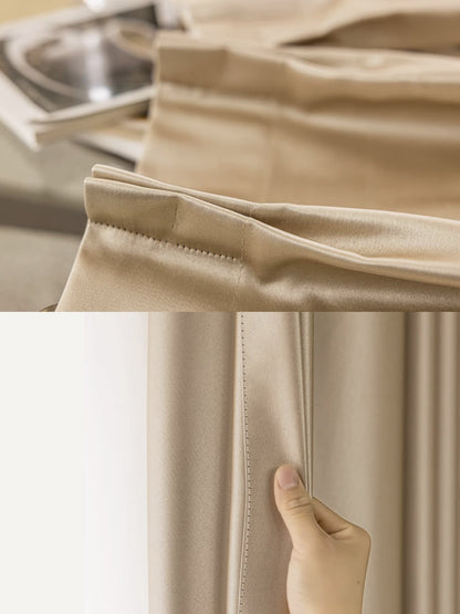 Close-up view of beige silk pleated drapery, emphasizing detailed stitching and smooth fabric texture, suitable for elegant home decor