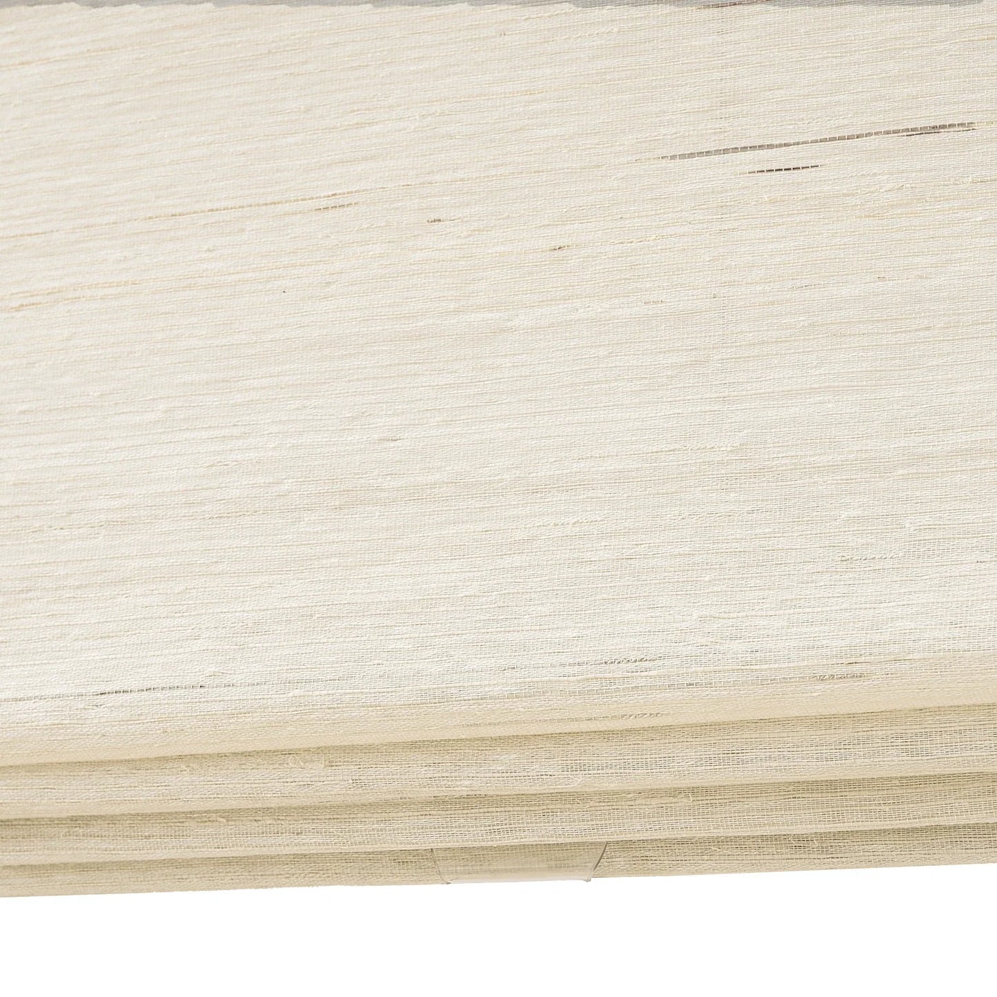 Coconut white natural ramie bamboo window shades with delicate woven texture.