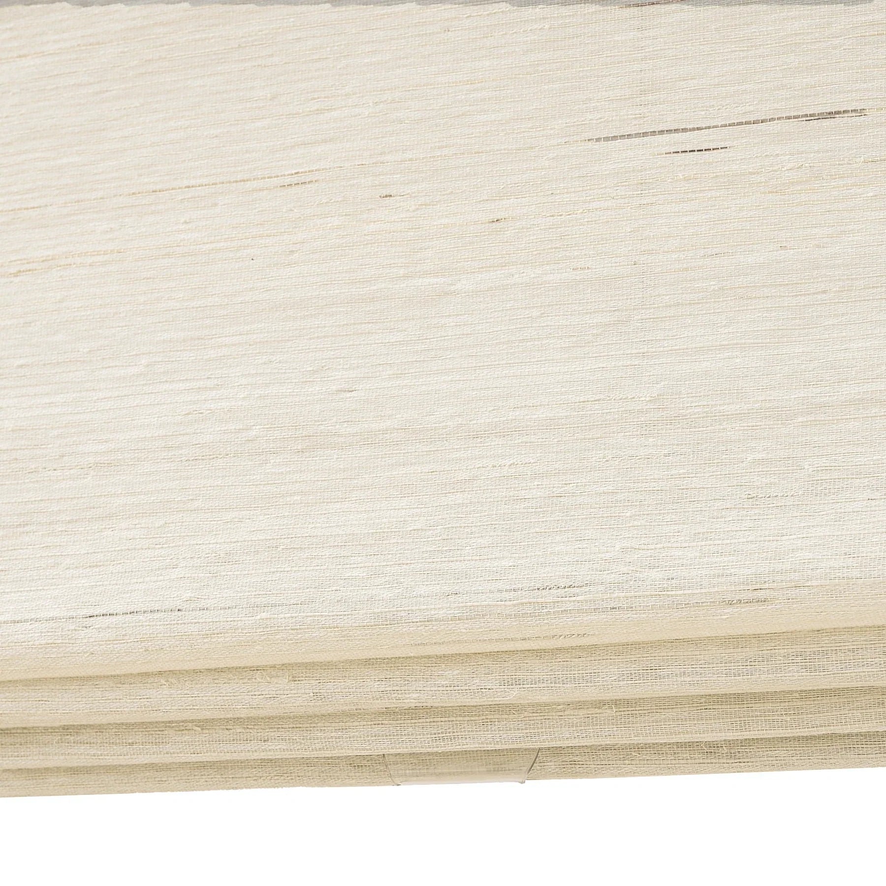 Coconut white natural ramie bamboo window shades with delicate woven texture.