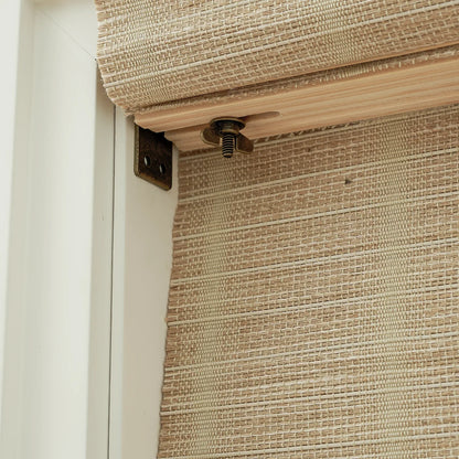Natural jute bamboo outdoor shades in oak, showing textured woven blinds detail.