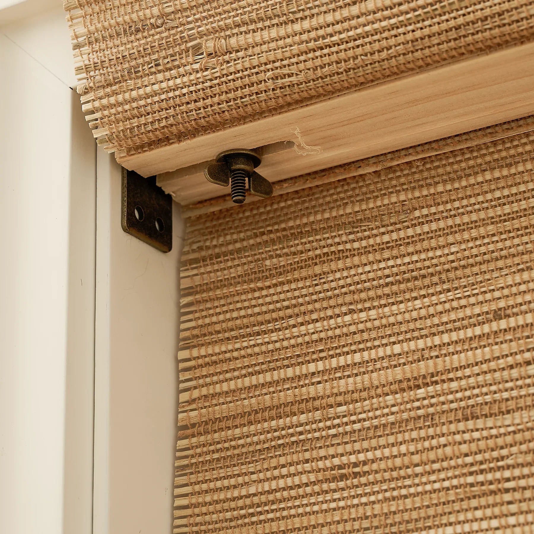 Natural hemp bamboo roman shades in bark color, showcasing handwoven texture and eco-friendly design.
