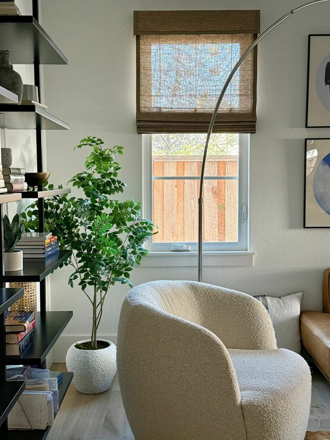 cozy living room with bamboo roman shades filtering natural light on window