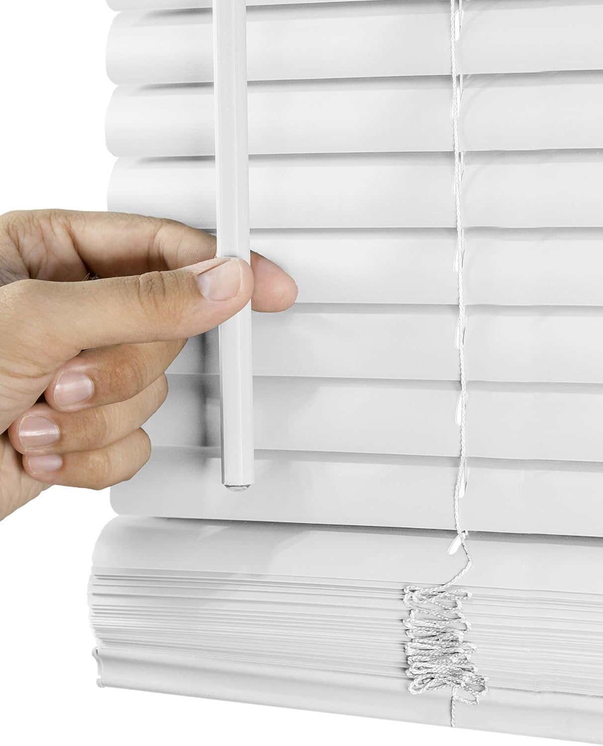 Close-up of a hand adjusting durable white vinyl mini blinds, showcasing the ease of operation and clean design, perfect for any room