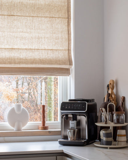 Custom roman shades in light-filtering fabric, cordless design, available in 33 colors.
