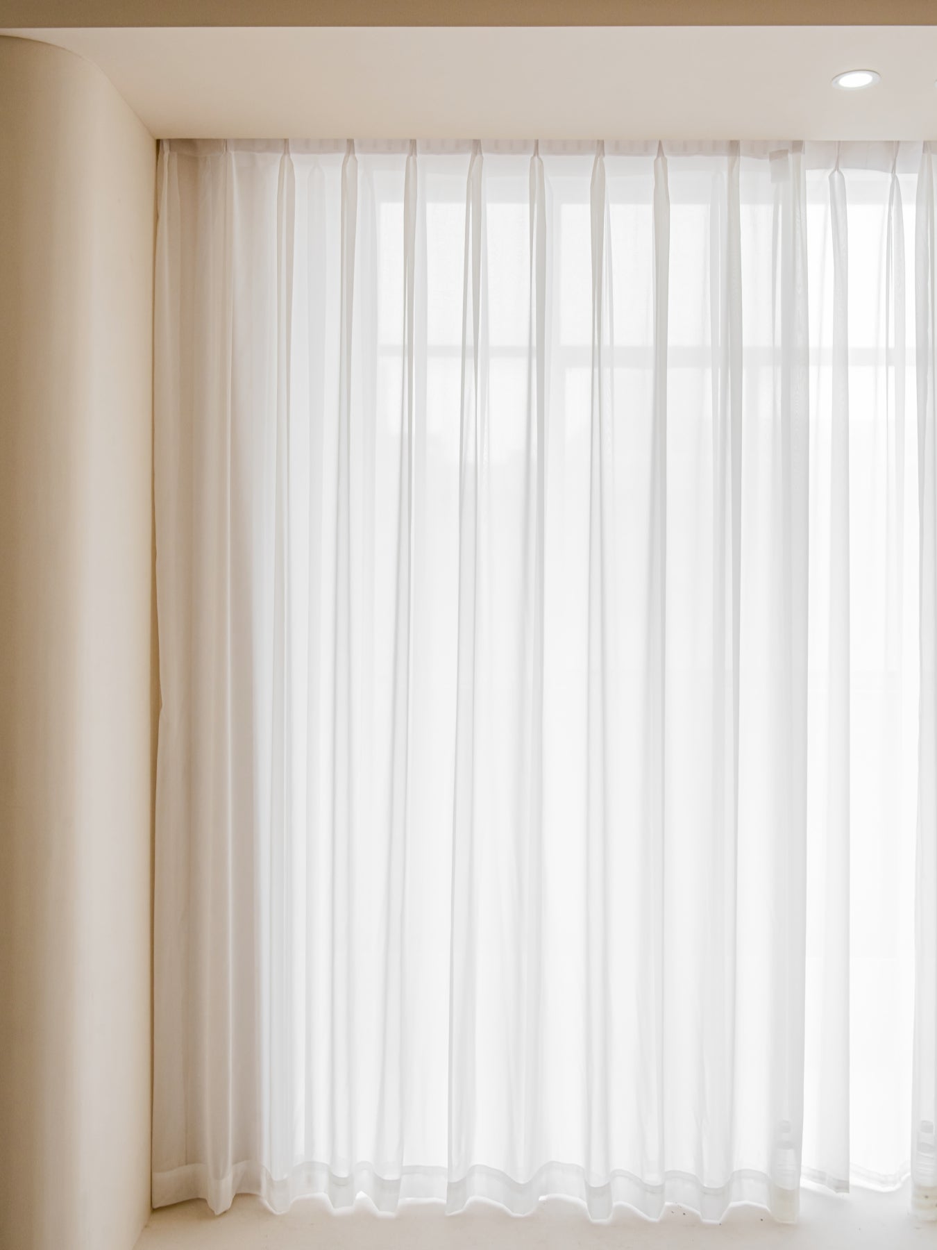 Cream Gauze Sheer Curtains from EaseEase providing delicate light filter in a serene room setting, embodying ethereal elegance and exceptional craftsmanship