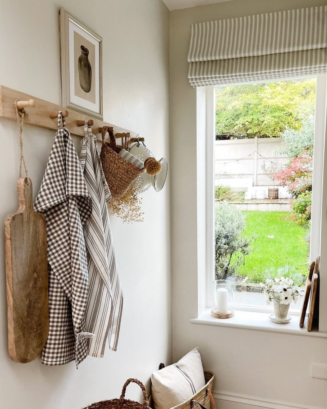 Custom cordless blackout Roman shades in a cozy bedroom setting.
