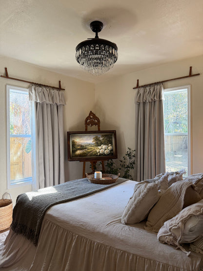 Classic linen striped curtains in neutral tones with fine and bold stripe widths hanging in a modern room