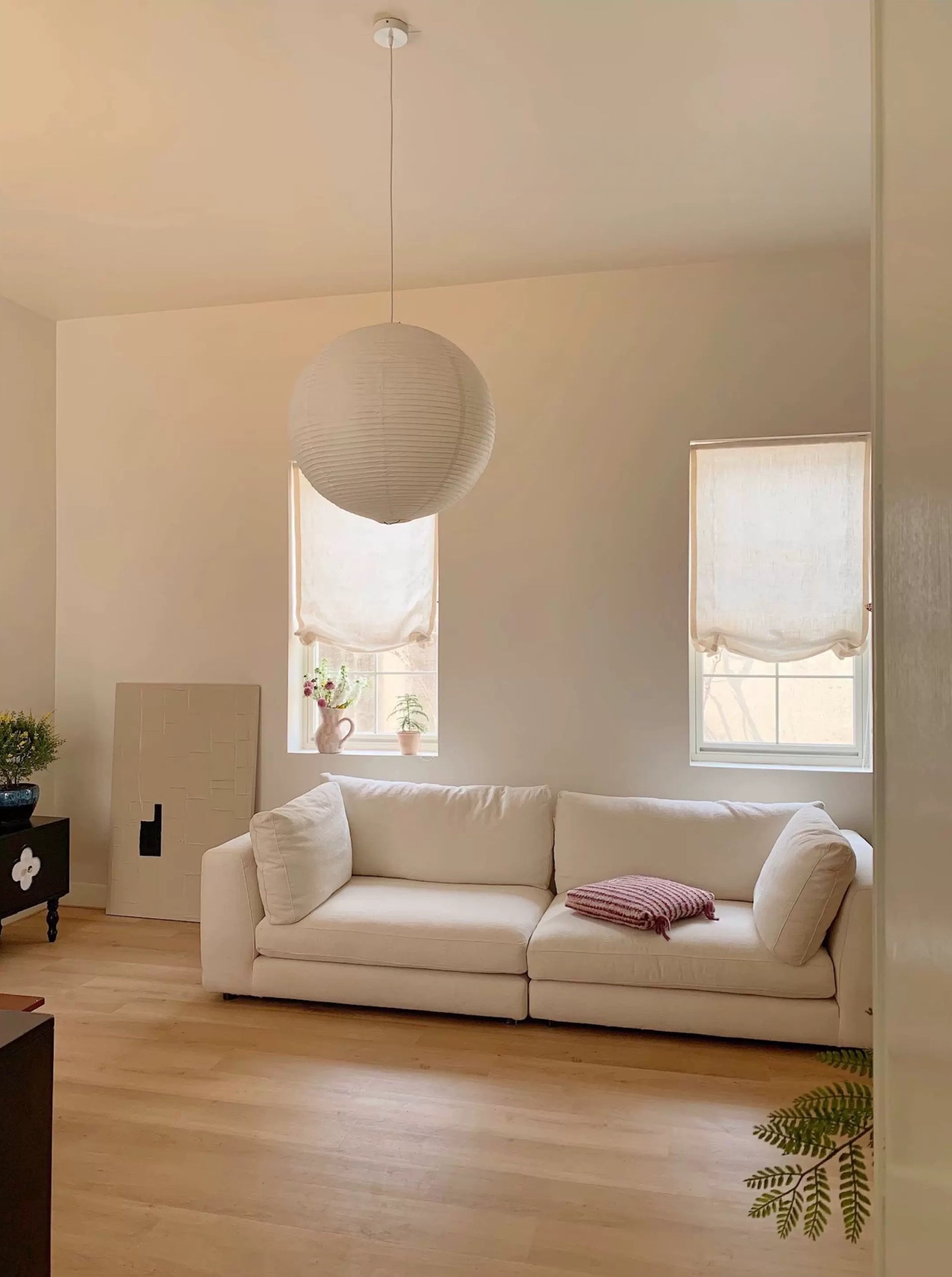 Custom relaxed Roman window shades in a light-filled room.