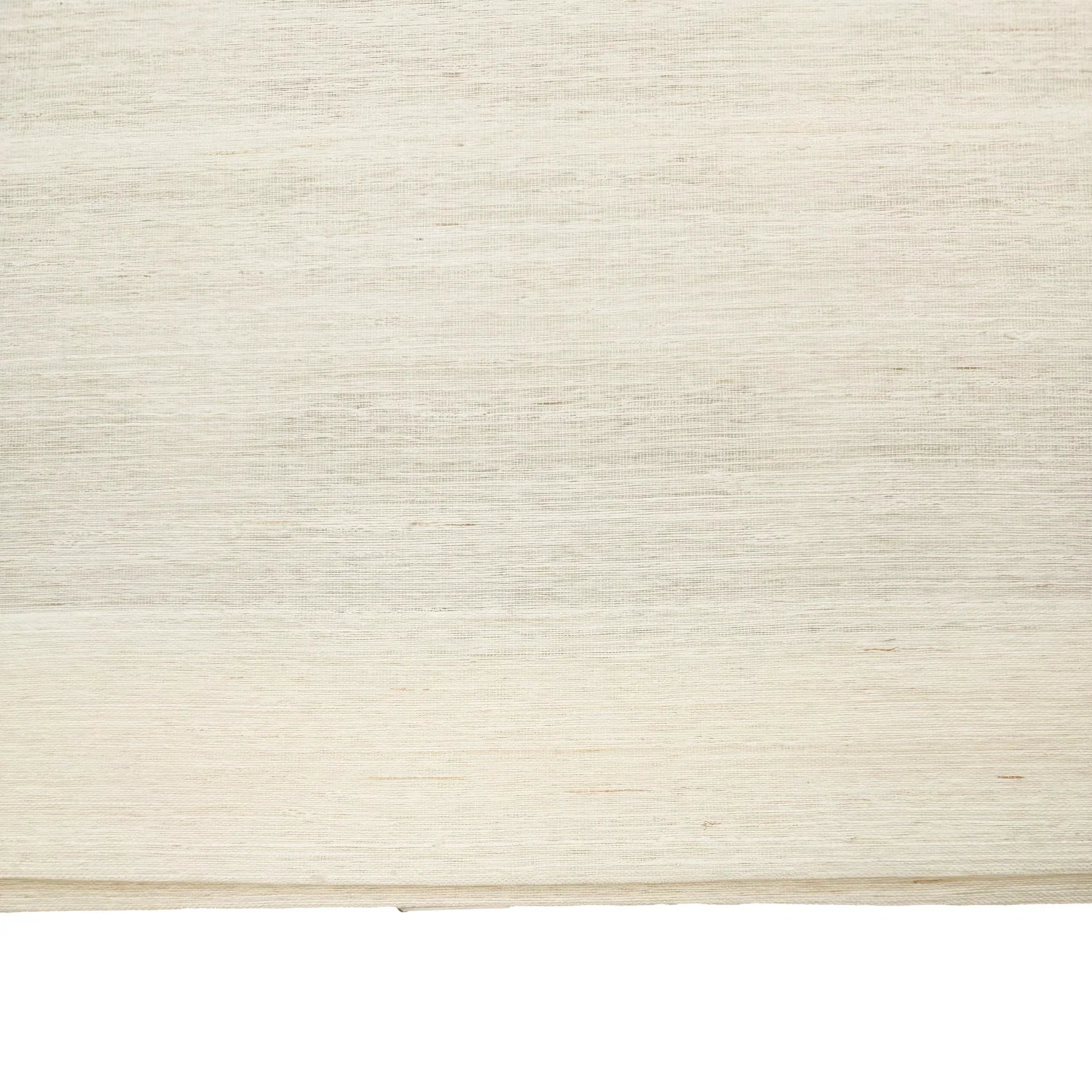 Natural ramie bamboo window shades in coconut white, featuring a delicate and refined texture, ideal for light interiors.