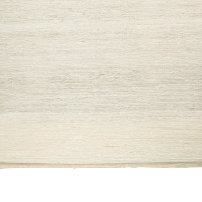 Natural ramie bamboo window shades in coconut white, featuring a delicate and refined texture, ideal for light interiors.