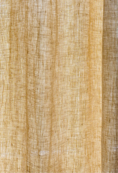 Close-up of soft pale yellow pure linen pleated curtain, highlighting the fine texture and natural weave of the French-imported fabric