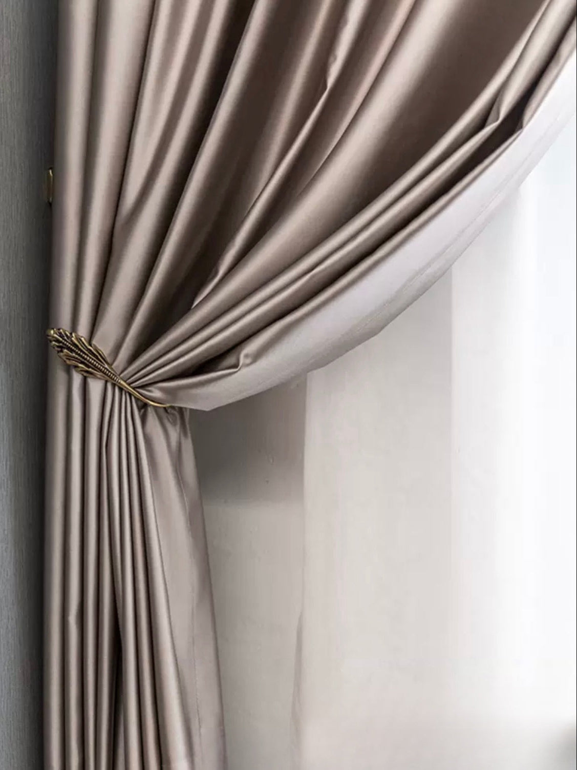 Silk curtains with elegant draping and light-blocking properties.