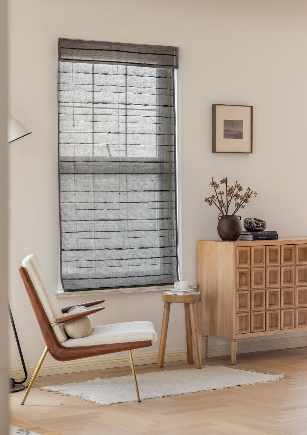 Natural ramie bamboo woven shades with black stripes in minimalist living room setting