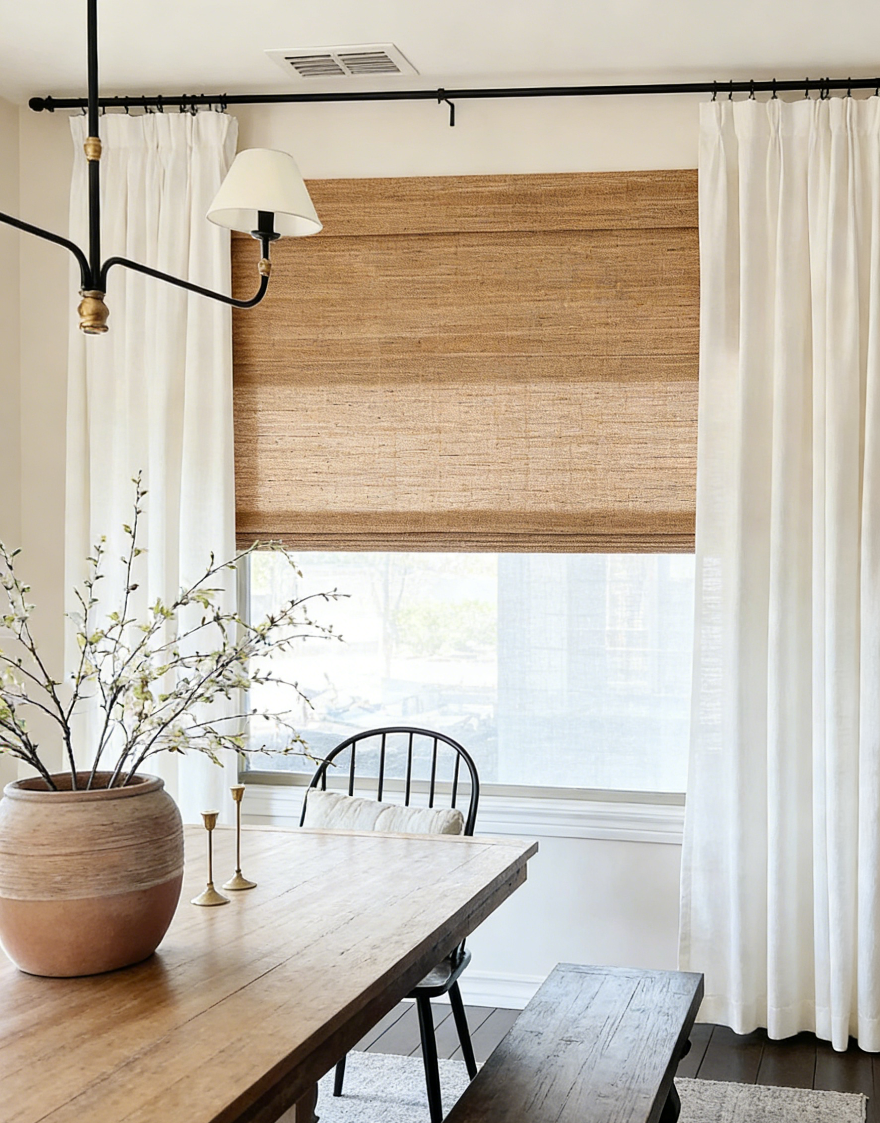 Brown woven jute blinds with natural texture filtering warm light in a modern farmhouse room