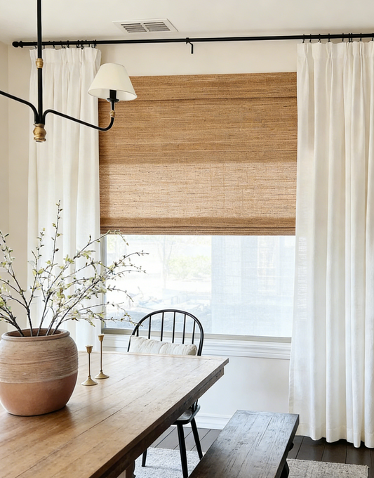 Brown woven jute blinds with natural texture filtering warm light in a modern farmhouse room
