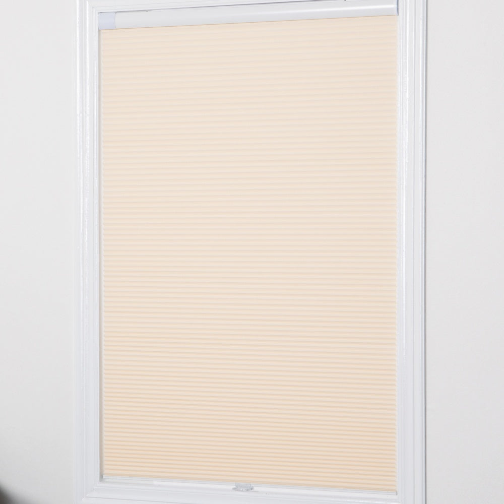 No-drill honeycomb shades installed on a window, showcasing a cordless and energy-efficient design.