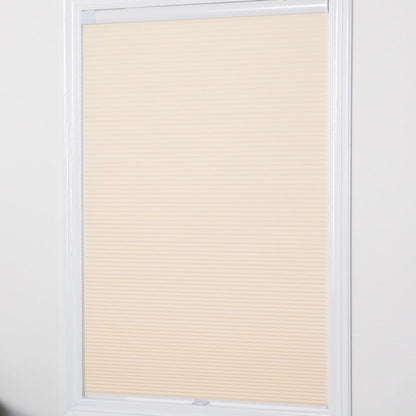 No-drill honeycomb shades installed on a window, showcasing a cordless and energy-efficient design.