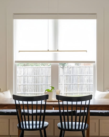 Solar shades on a window, UV blocking cordless roller blinds, modern design.
