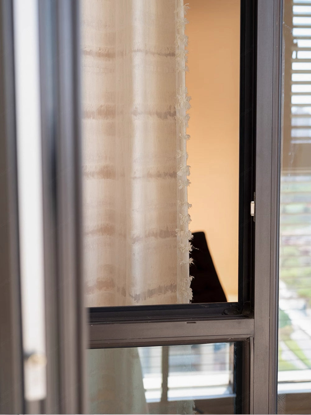 Designer "Mousse Cake" sheer curtain with horizontal fringe texture in living room.