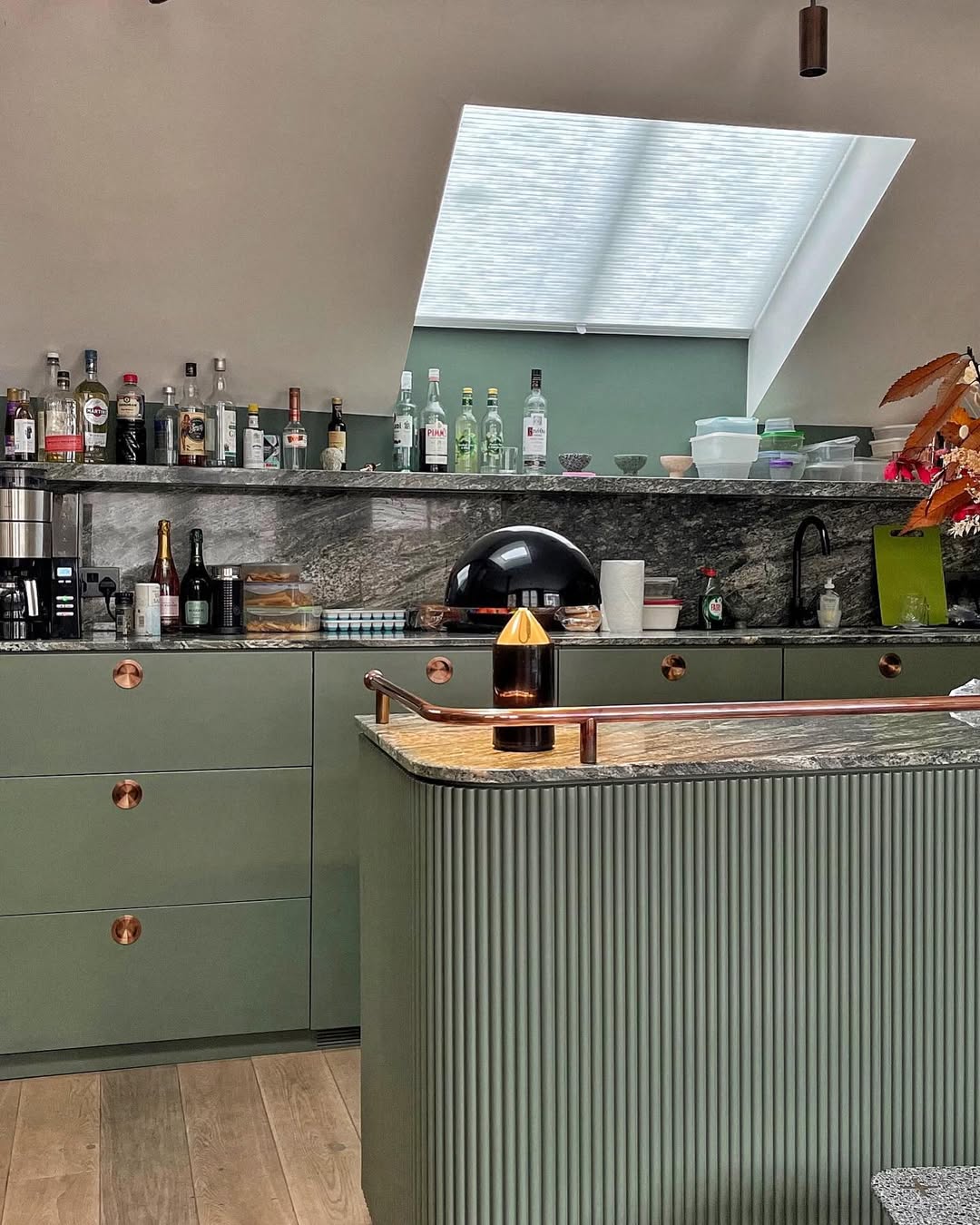 Honeycomb cellular skylight blinds installed in modern kitchen setting.