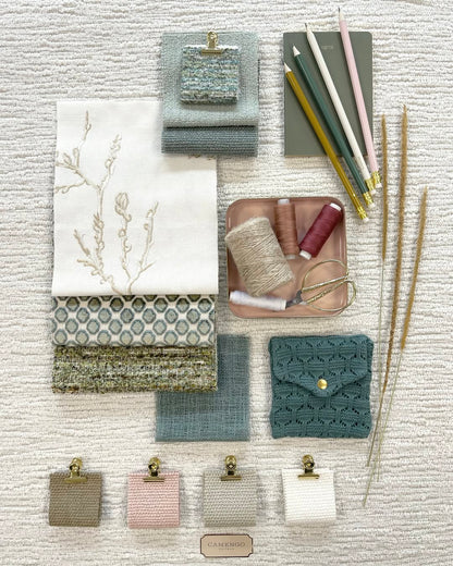 Patterned fabric roman shades with flat fold style, featuring a variety of textures and colors, ideal for light filtering and blackout options.