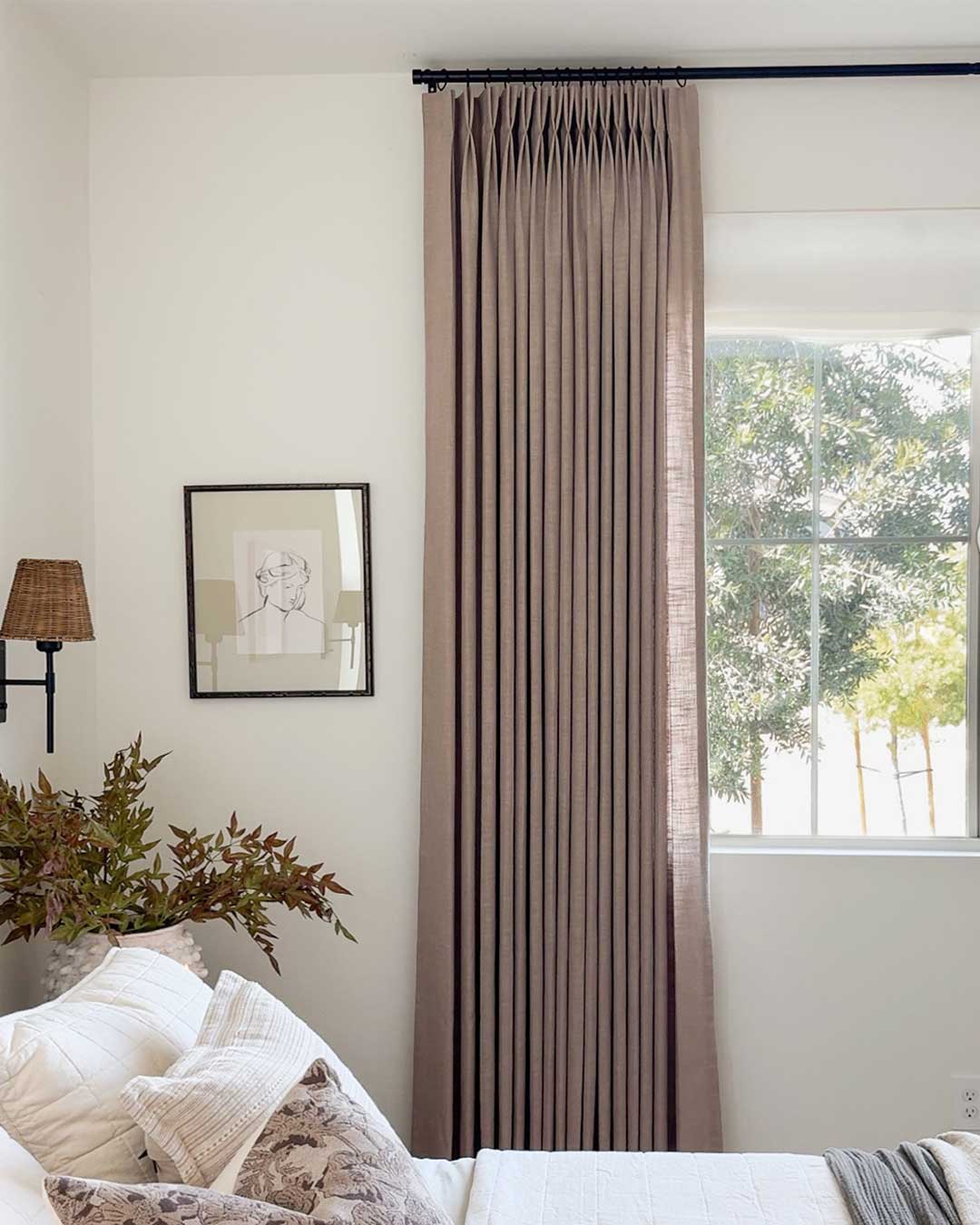 Linen blackout curtains in a modern bedroom setting with natural light.