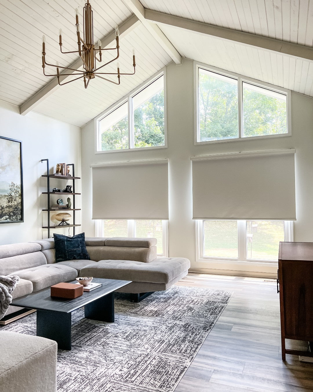 Solar shades on windows in a modern living room, offering UV protection and cordless design.