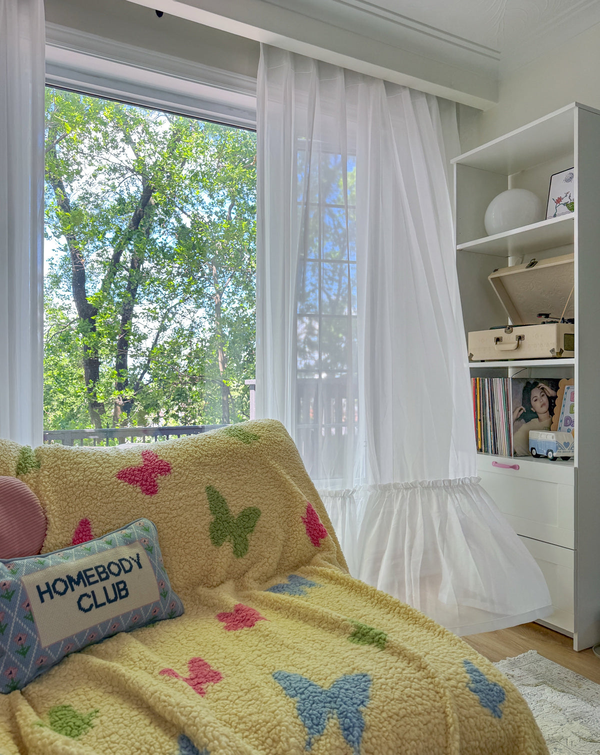 Cream sheer curtains with ruffled hem in a princess room