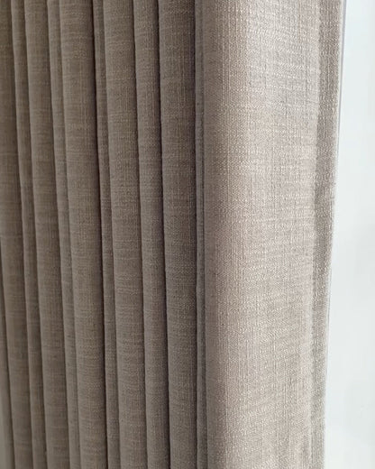 Linen blackout curtains in a natural hue, showcasing texture and style.