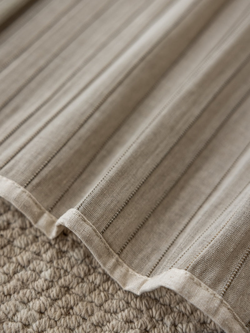 Natural linen bamboo shade with black stripes, eco-friendly and handcrafted.