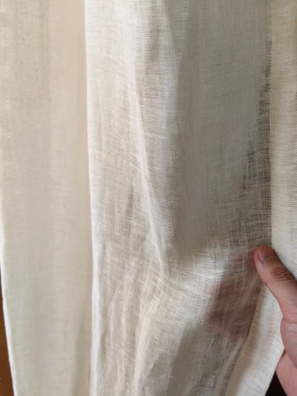 Close-up of French-imported pure white linen curtain showcasing delicate weaving and natural sheer texture, ideal for sophisticated home decor