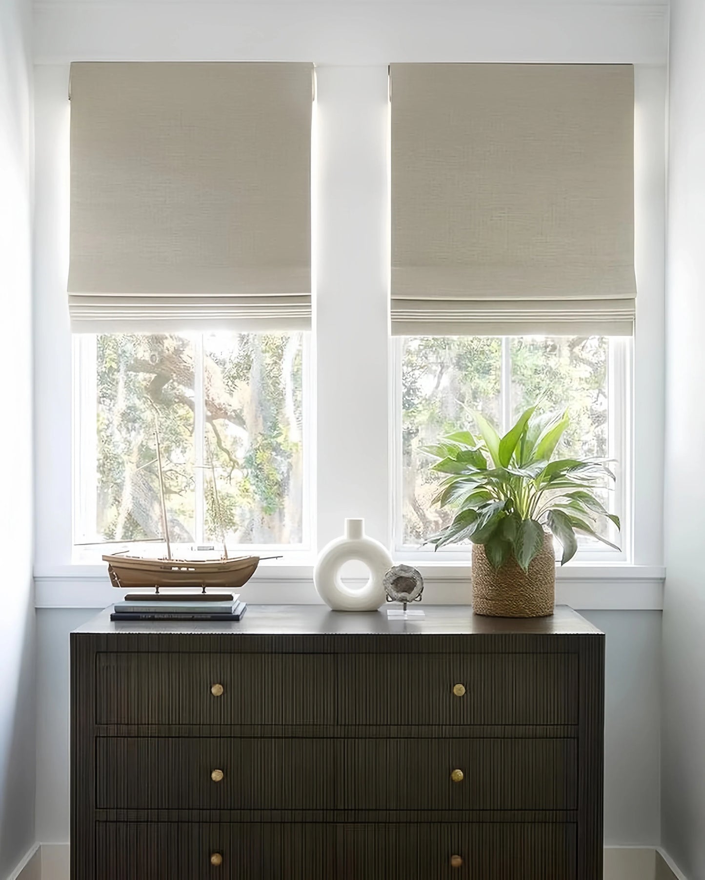 Custom Cordless Blackout Roman Shades for Bedrooms in beige color, blocking light for privacy and comfort.