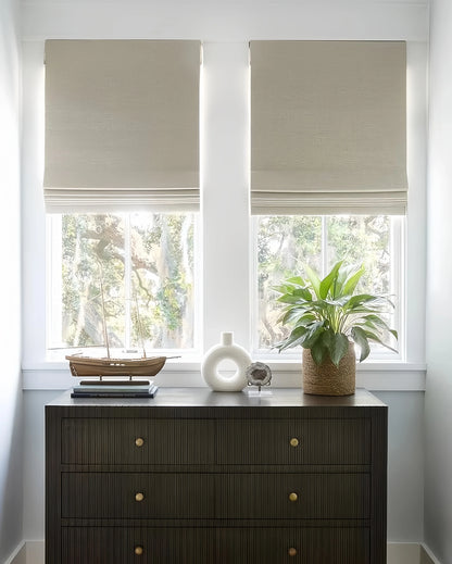 Custom Cordless Blackout Roman Shades for Bedrooms in beige color, blocking light for privacy and comfort.