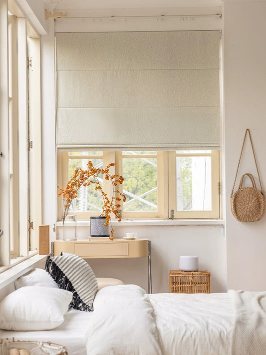 Eco-friendly cordless Roman blind in a stylish bedroom, providing 100% blackout for privacy and enhanced sleep quality
