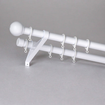 Adjustable curtain rod with heavy-duty alloy bracket for smooth, tug-free operation on residential windows