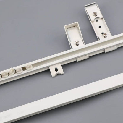 Ultra-thin, quiet aluminum ceiling curtain track installed on a flat ceiling