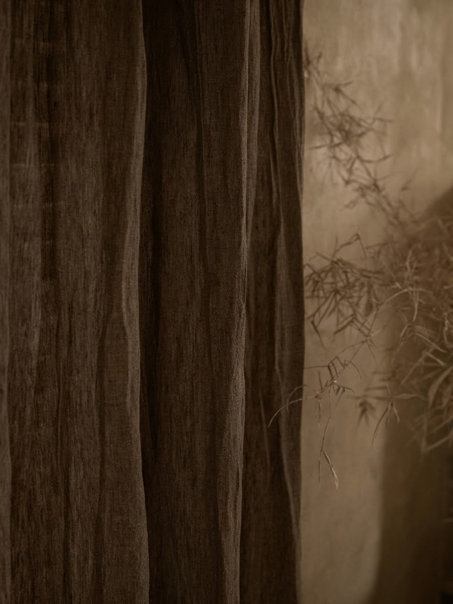 Coffee brown linen curtains in sheer, softly textured fabric with natural creases and gently gathered folds