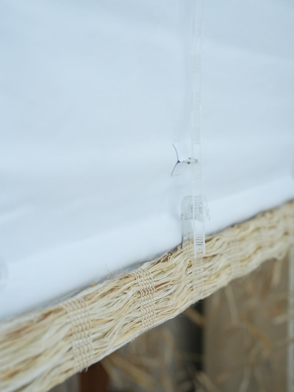 close-up of honey-colored cordless bamboo shades woven shades made from natural ramie fiber with breathable texture