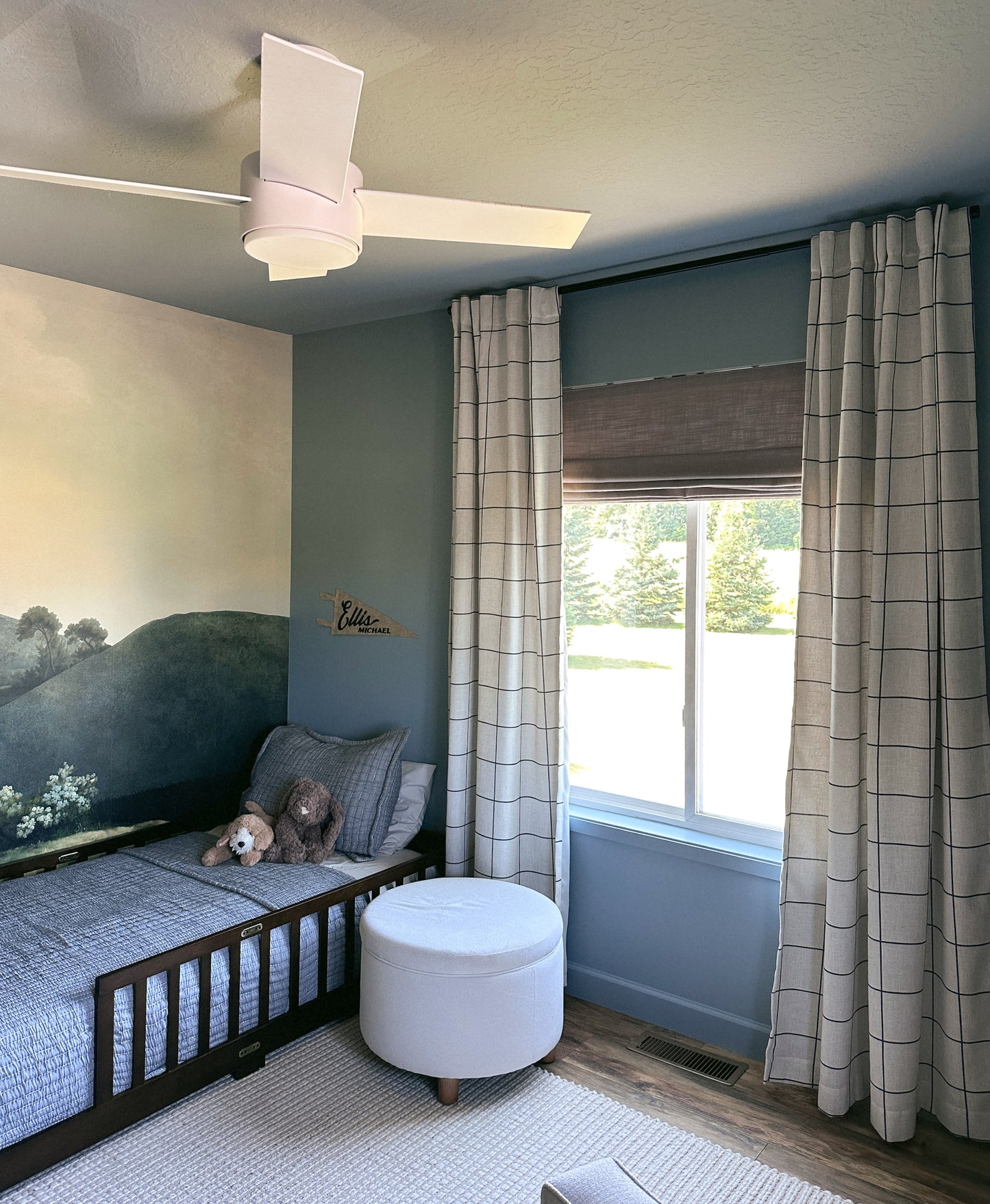 Custom cordless roman shade in natural linen fabric for light-filtering and blackout window treatment