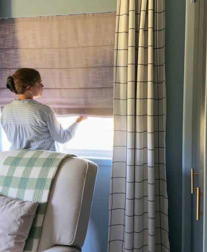 Custom Roman Shade in natural linen with cordless design light-filtering and blackout options for living rooms and bay windows