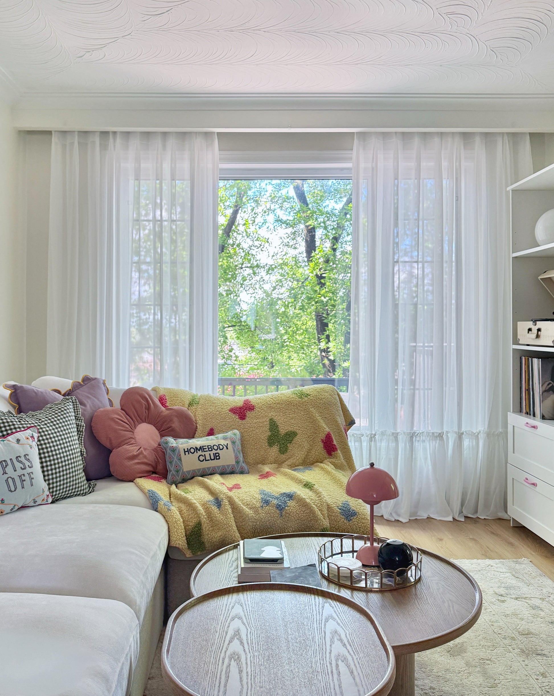 Cream sheer curtains with ruffled hem in a princess room setting