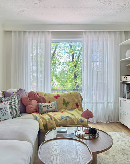 Cream sheer curtains with ruffled hem in a princess room setting