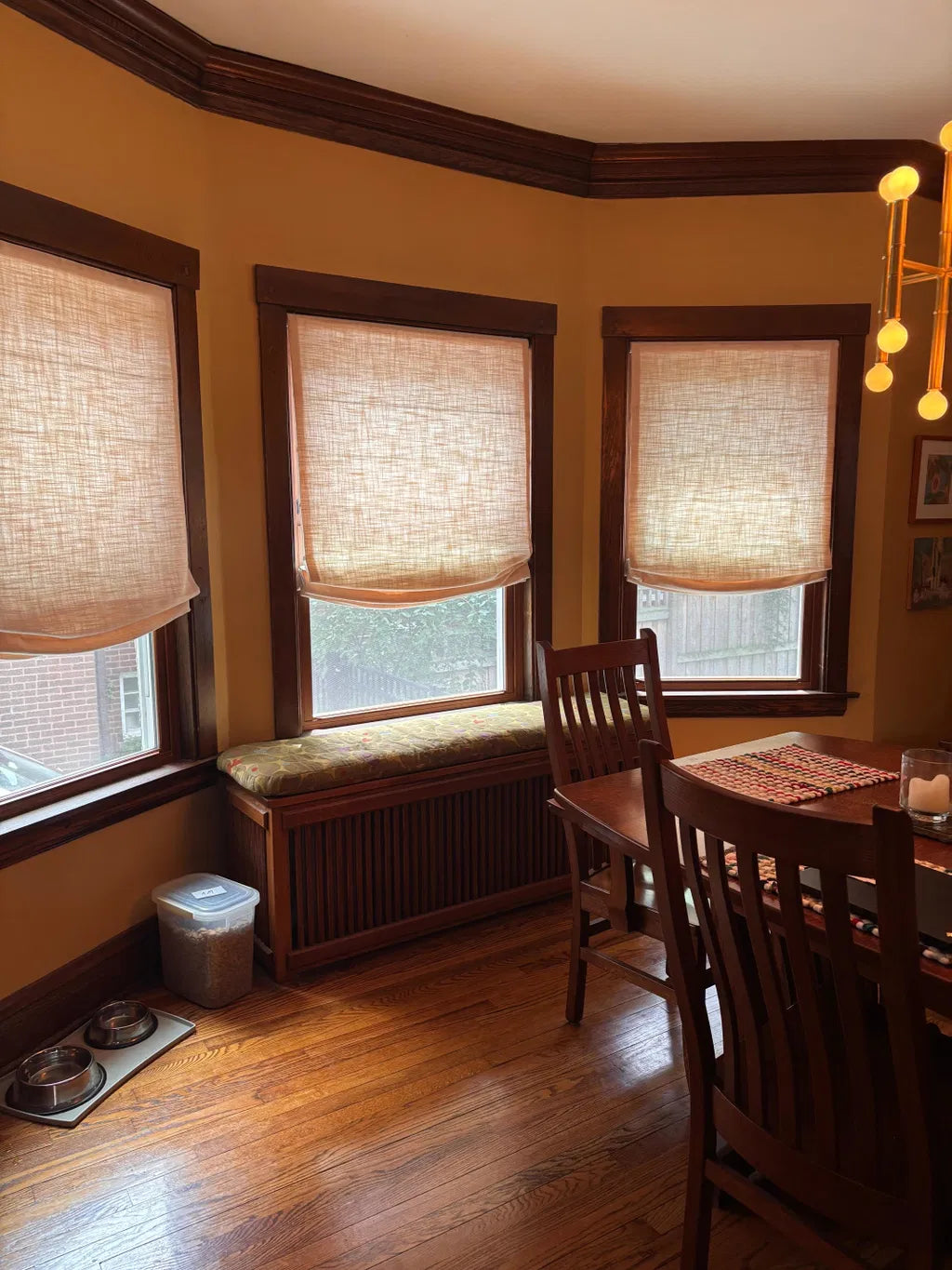 Soft natural linen-blend relaxed roman shades with cordless lift in modern living room