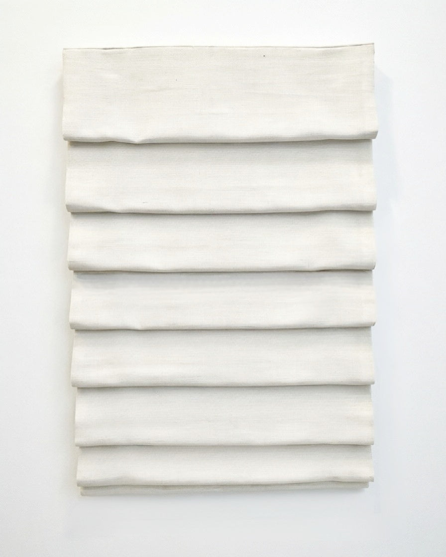 custom hobbled roman shades in ivory linen-blend fabric with soft, evenly spaced cascading folds
