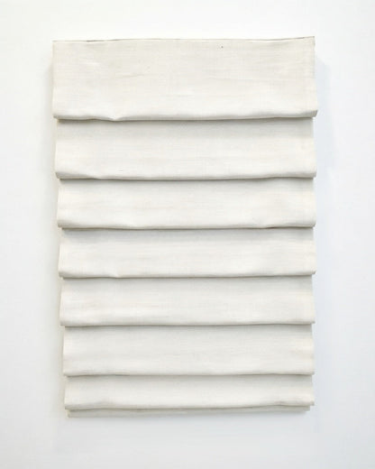 custom hobbled roman shades in ivory linen-blend fabric with soft, evenly spaced cascading folds